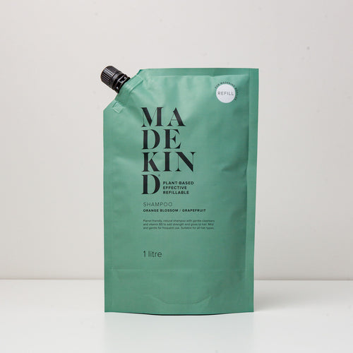 Photo of a 1 Litre refill pouch of MadeKind's natural shampoo with orange blossom & grapefruit essential oils